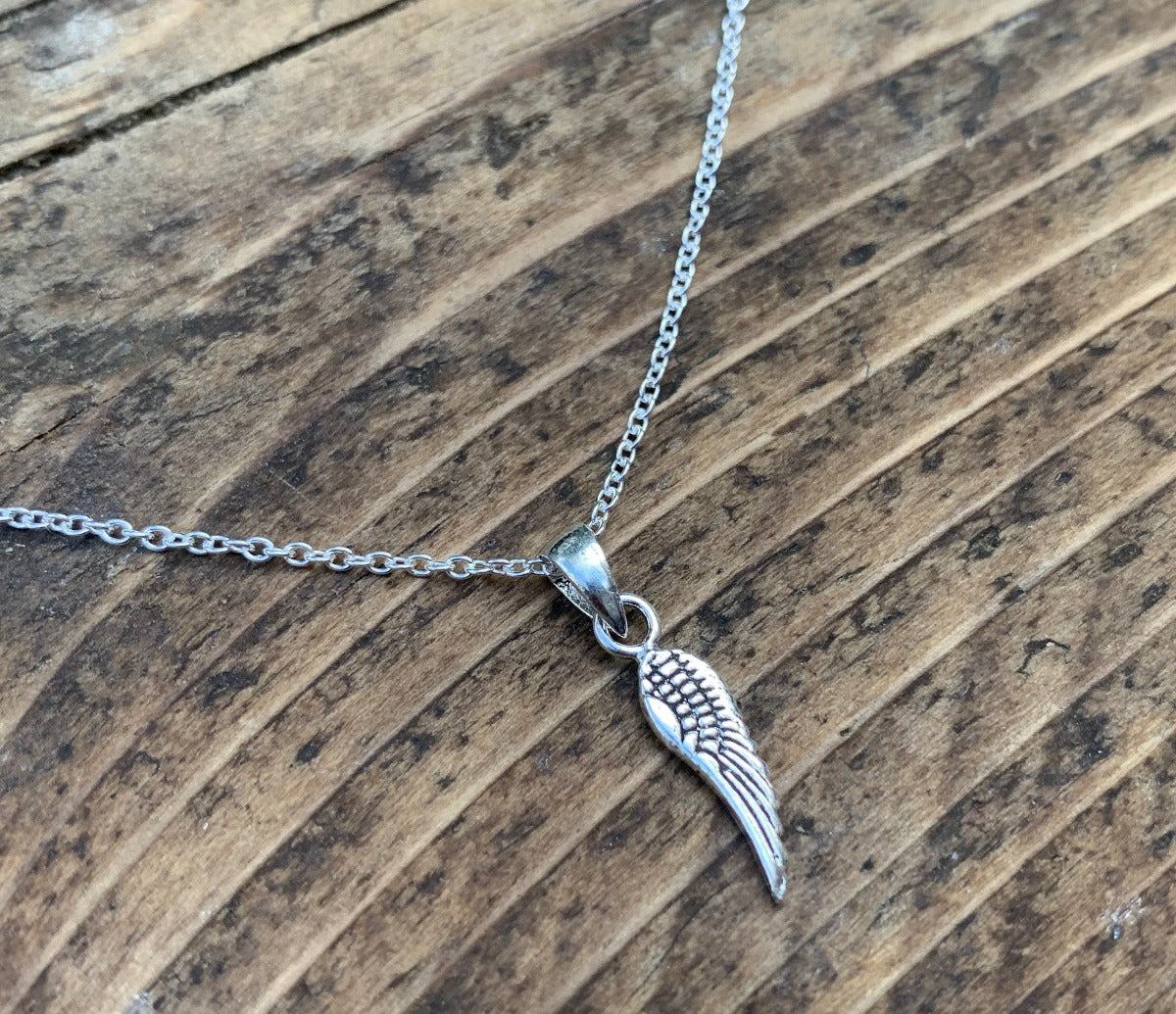 Tiny Silver Wing Charm Necklace by Springwaves