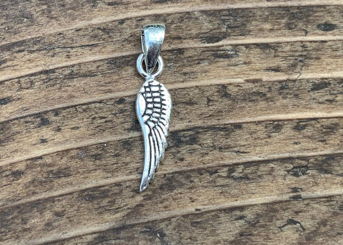 Tiny Silver Wing Charm Necklace by Springwaves
