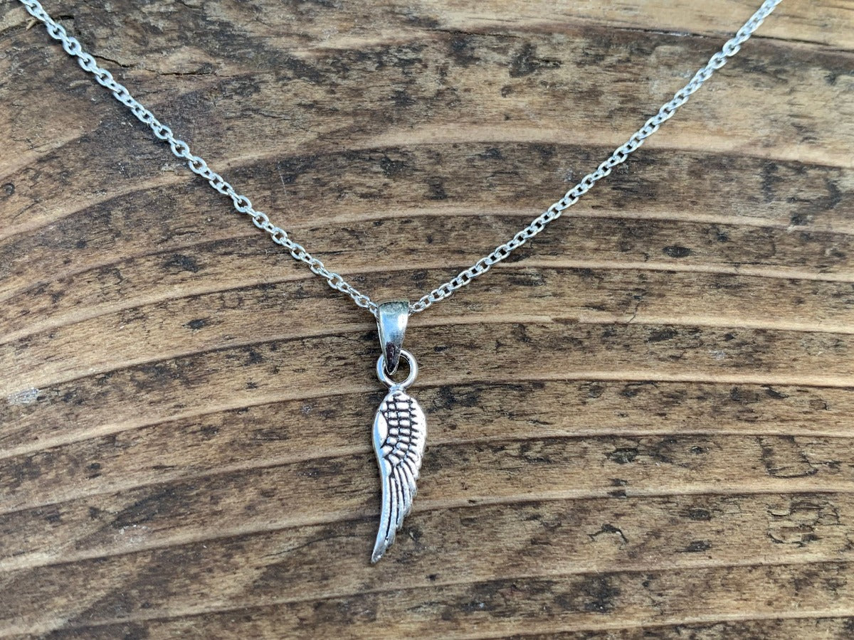 Tiny Silver Wing Charm Necklace by Springwaves