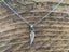 Tiny Silver Wing Charm Necklace by Springwaves