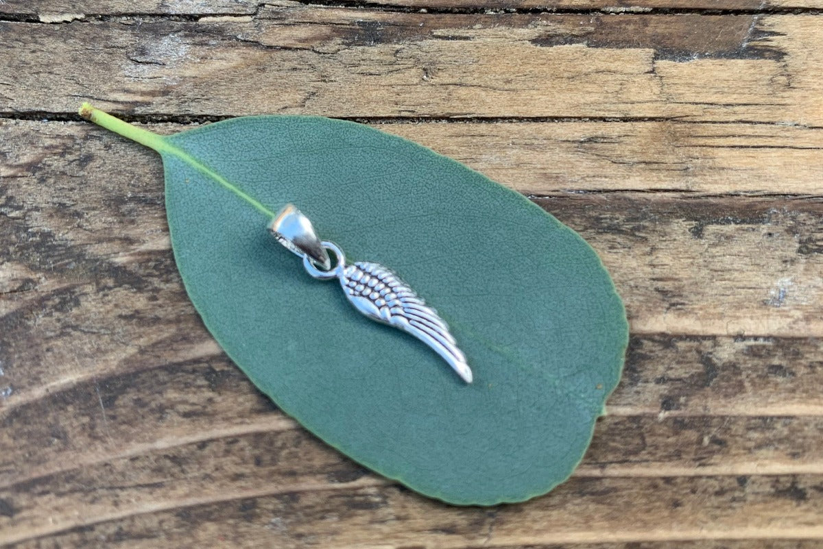 Tiny Silver Wing Charm Necklace by Springwaves