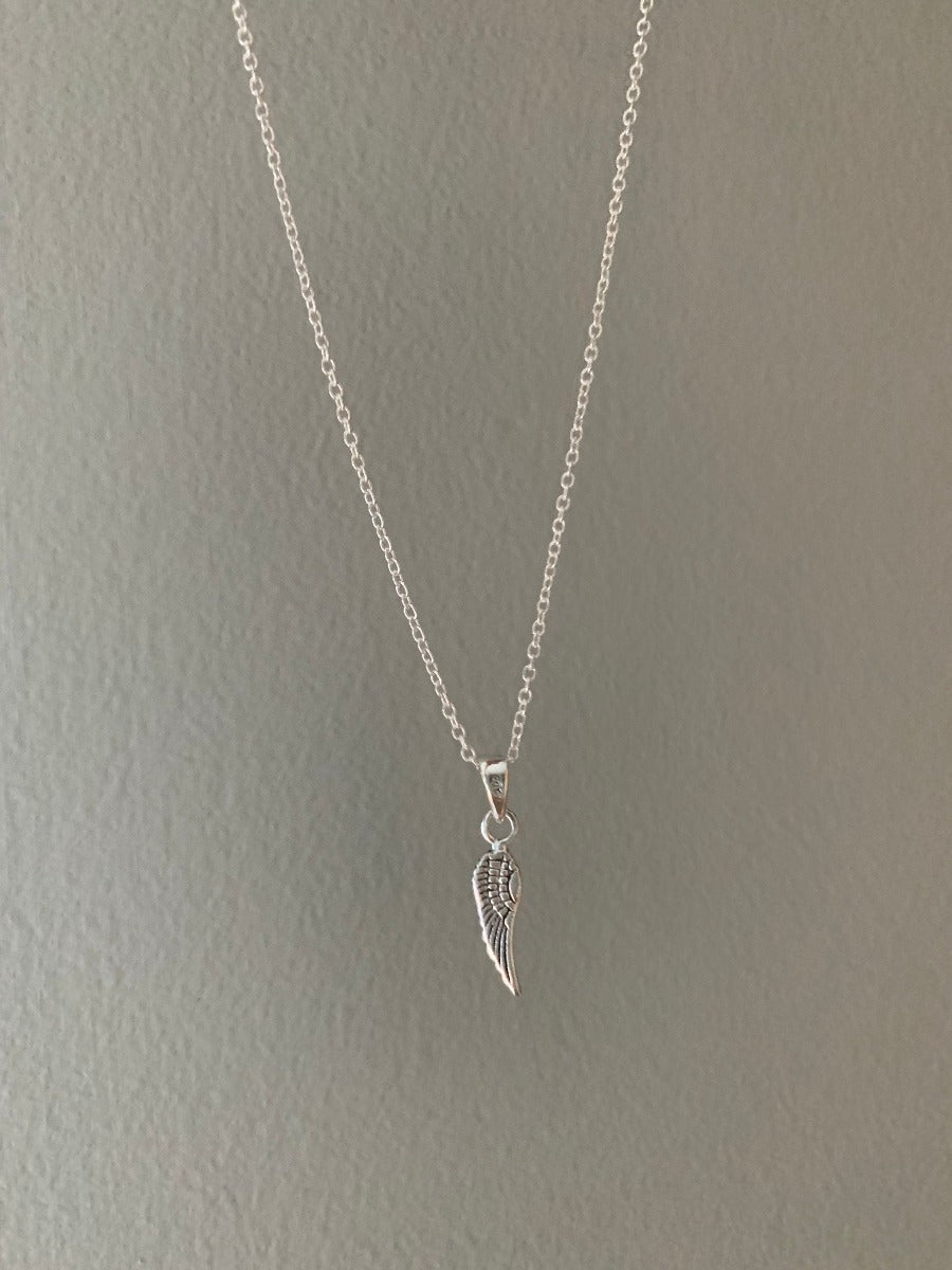 Tiny Silver Wing Charm Necklace by Springwaves