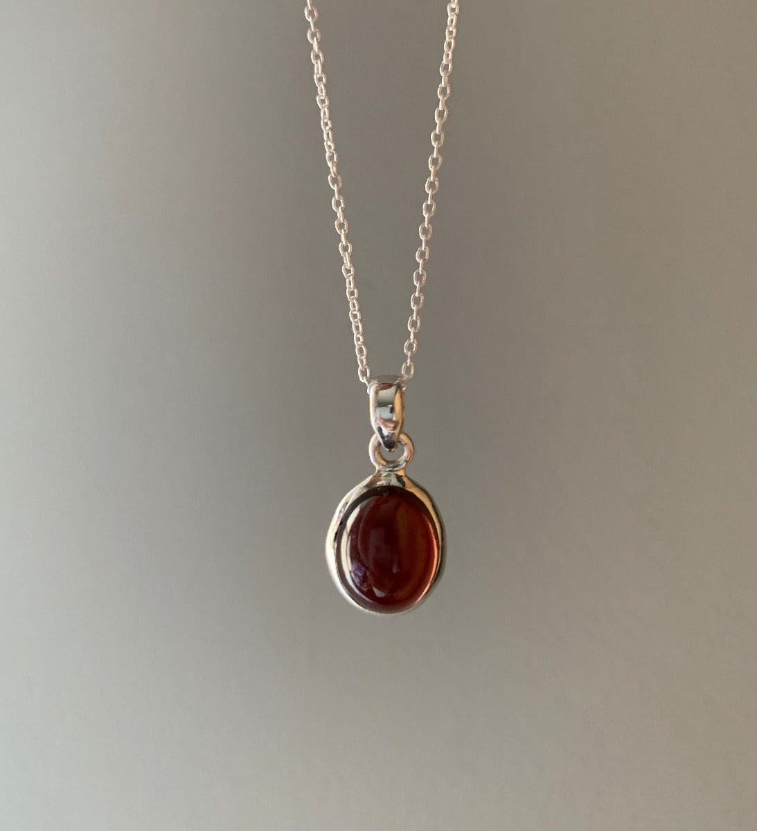 Sterling Silver Classic Oval Garnet Necklace Pendant by Springwaves
