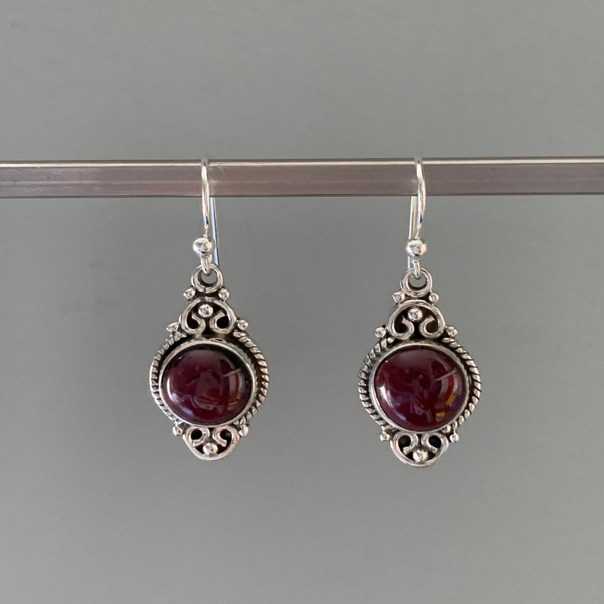 Delicate Ornate Silver Garnet Drop Earrings by Springwaves