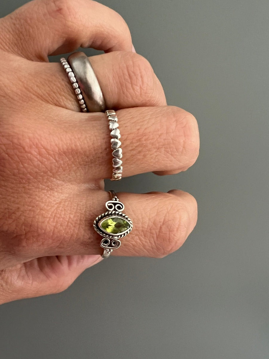 Delicate Faceted Peridot Period Ring by Springwaves