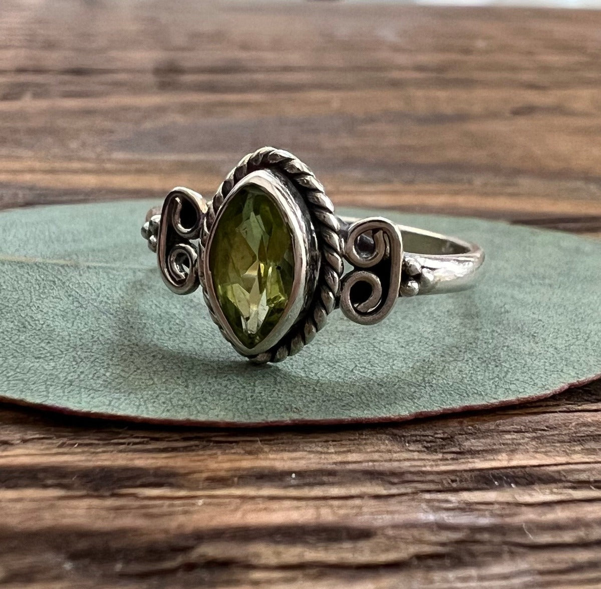 Delicate Faceted Peridot Period Ring by Springwaves