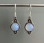 Delicate Ornate Silver Opalite Drop Earrings by Springwaves