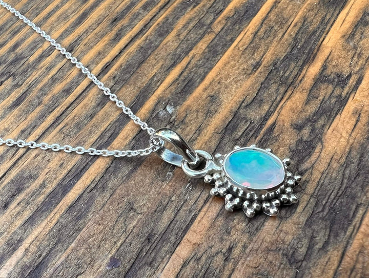 Faceted Opal Sunburst Oval Necklace