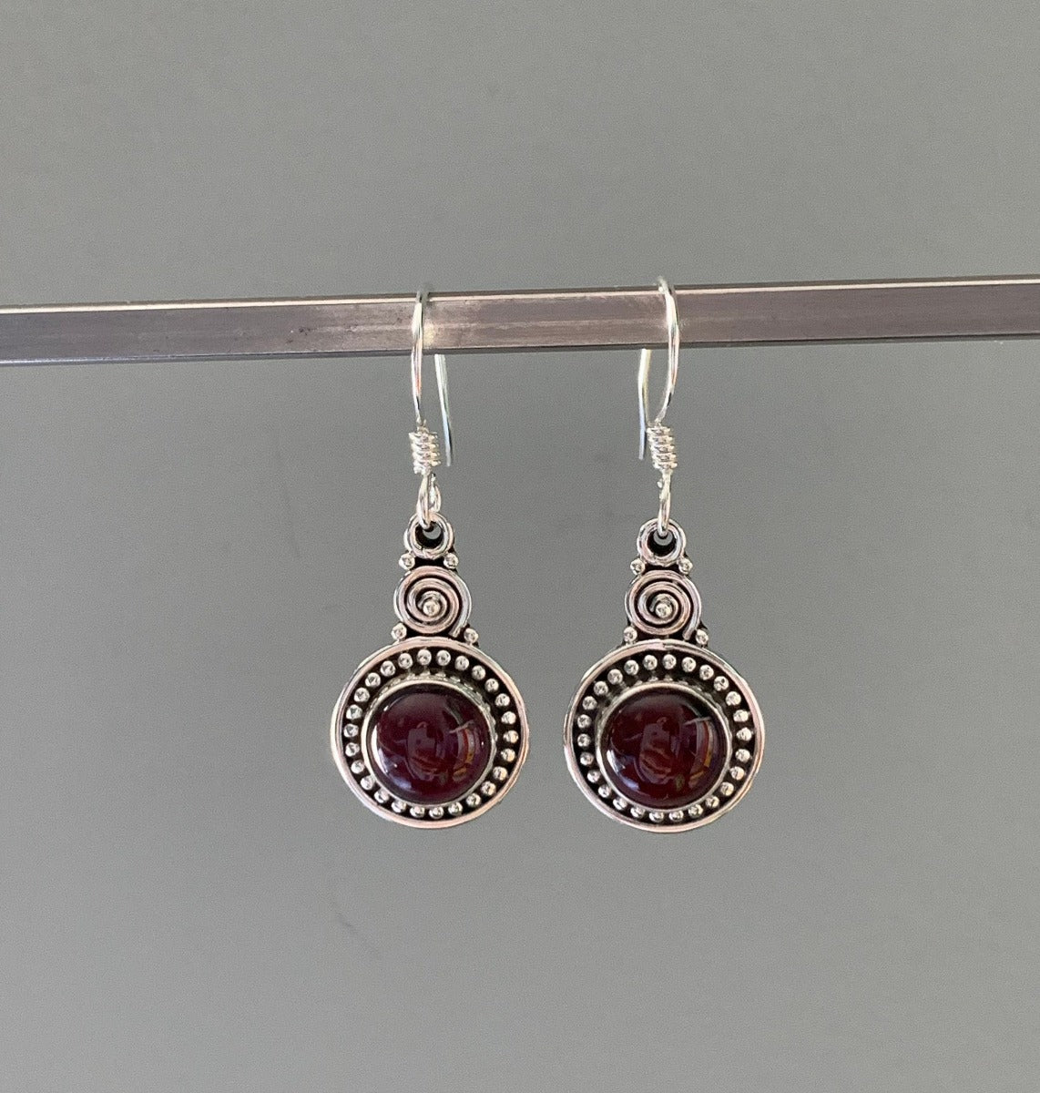 Ornate Round Boho Garnet Silver Drop Earrings by Springwaves
