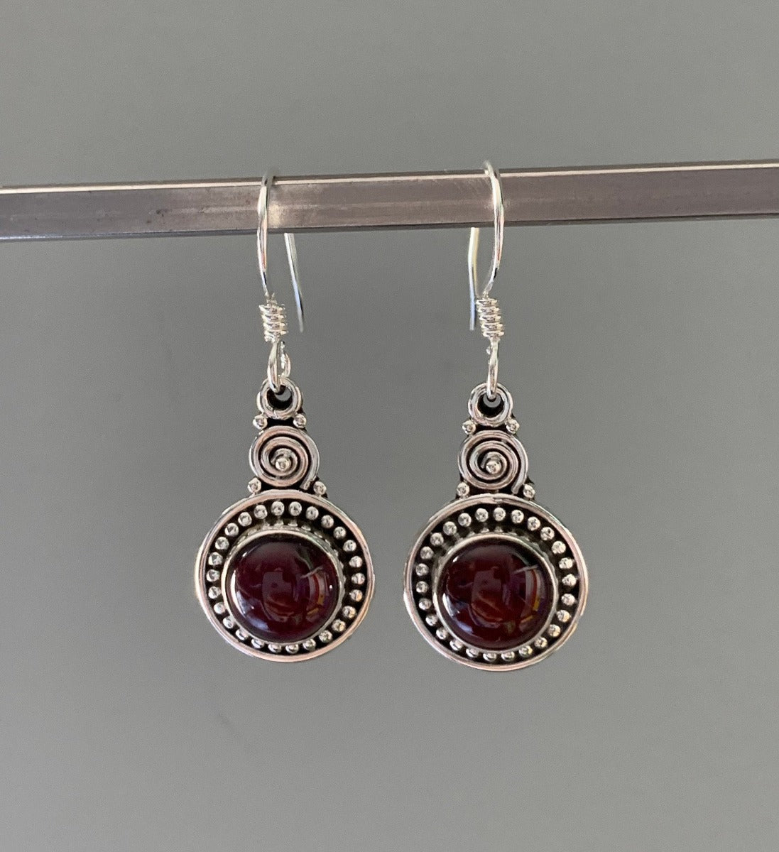 Ornate Round Boho Garnet Silver Drop Earrings by Springwaves